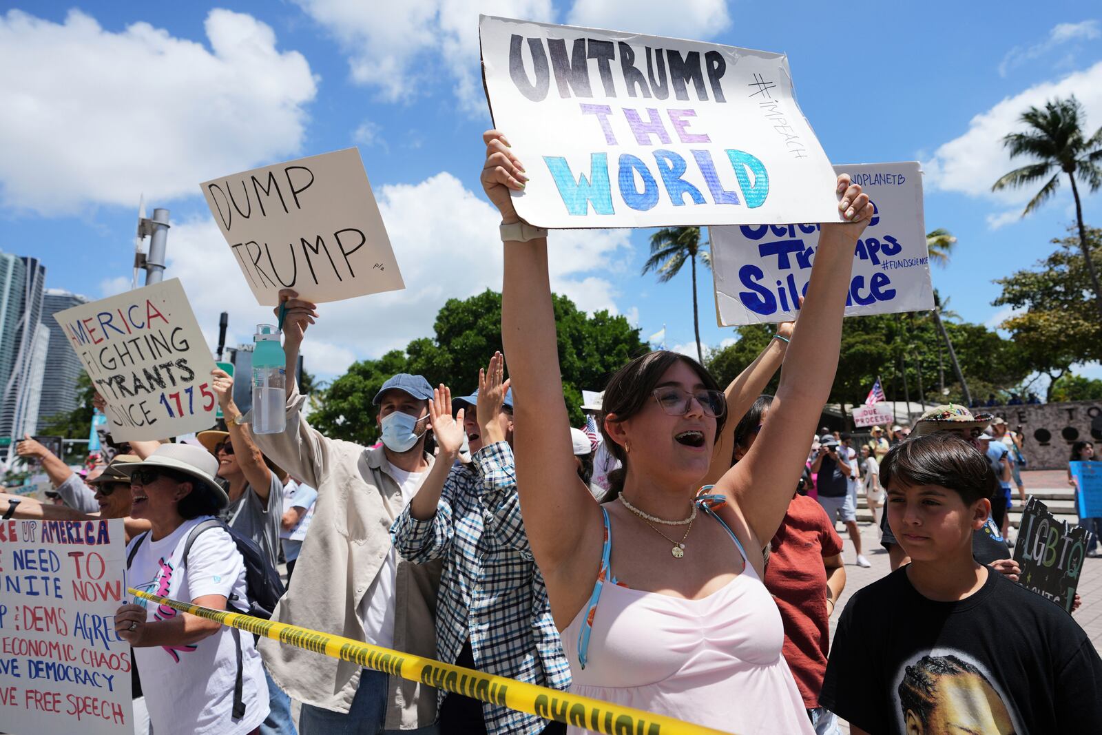 Amelie Gayoso chants slogans during a protest against the Trump administration, Saturday, April 19, 2025, in Miami. (AP Photo/Lynne Sladky)