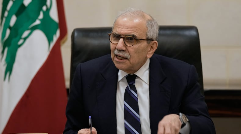 Lebanese Prime Minister Nawaf Salam speaks to journalists working for foreign media and news agencies at the government palace in Beirut, Wednesday, Dec. 3, 2025. (AP Photo/Bilal Hussein)