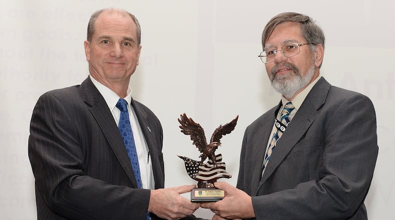 Dr. Ken Barker, Air Force senior leader for Systems Engineering and acting director of Engineering and Technical Management/Services, Air Force Life Cycle Management Center, presents the 2017 Air Force Life Cycle Management Center Engineering Frederick T. Rall Jr. Lifetime Achievement Award to Anthony J. DalSasso, chief engineer, Simulators Program Office, Agile Combat Support Directorate, during a ceremony at Wright-Patterson Air Force Base Feb. 15. DalSasso performed in various engineering roles throughout AFLCMC and its predecessor engineering section chief, and ultimately the chief engineer of the Simulators Program Office. (U.S. Air Force photo/Michelle Gigante)
