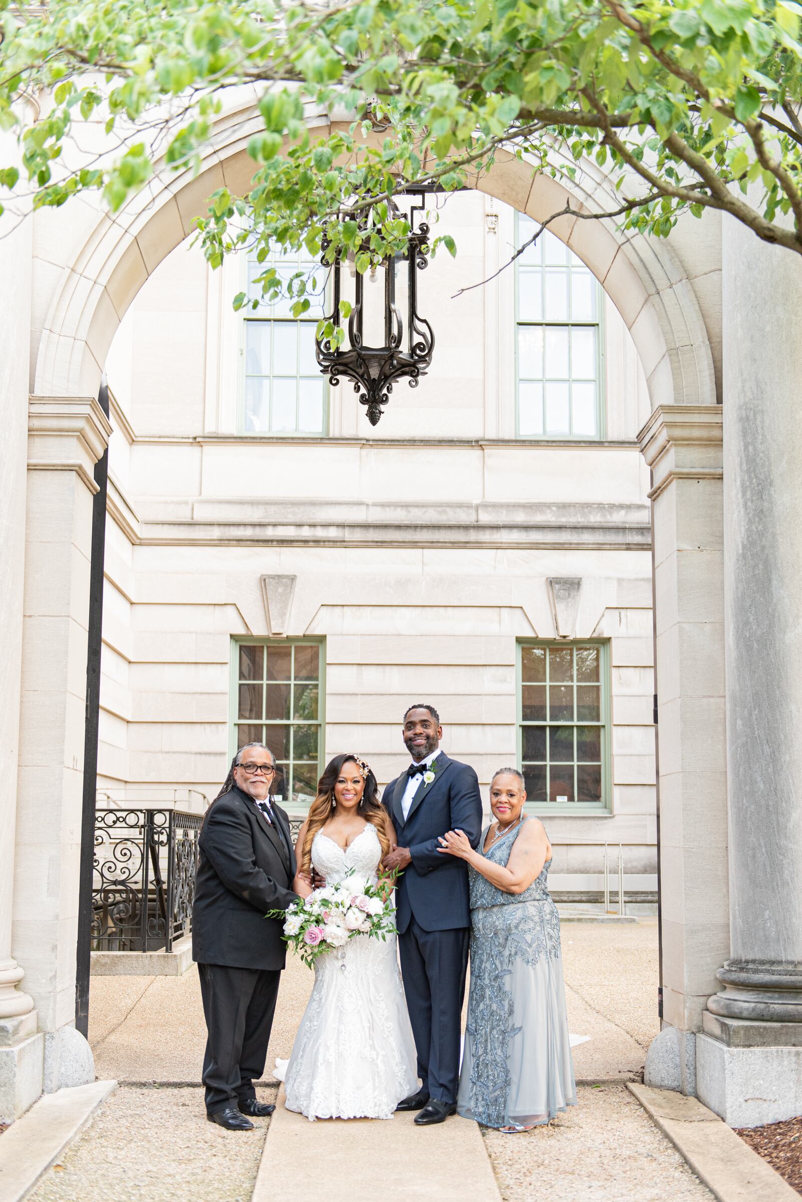 Stephen and Robyn Ross Jr. on their wedding day in 2021 with his parents Steve Sr. and Karen Ross. TERRI BASKIN PHOTOGRAPHY