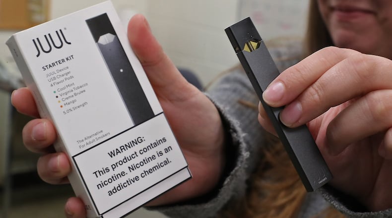 A Juul starter kit with a Juul device. BILL LACKEY/STAFF