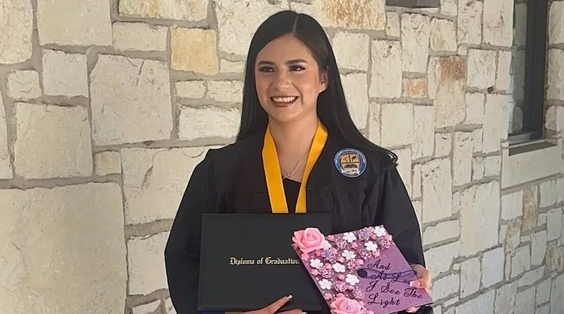 FILE - In this undated photo provided by her attorney, Todd Pomerleau, in January 2025, Any Lucia Lopez Belloza celebrates her high school graduation in Texas. (Any Lucia Lopez Belloza's attorney via AP, File)