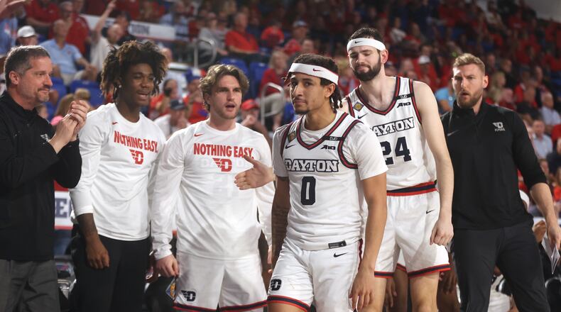 Dayton players react after a basket by Javon Bennett in the second half against Florida Atlantic in the first round of the NIT on Wednesday, March 19, 2025, at Baldwin Arena in Boca Raton, Fla. David Jablonski/Staff