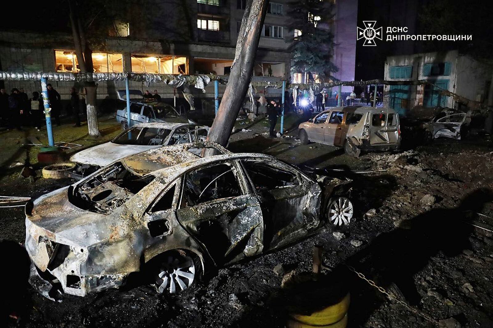 In this photo, provided by the Ukrainian Emergency Service, firefighters extinguish fire following a Russian attack in Dnipro, Thursday, April 17, 2025. (Ukrainian Emergency Service via AP)