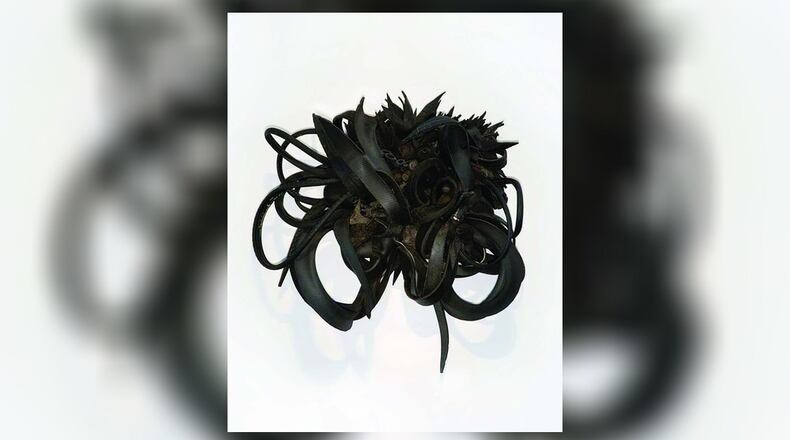 "Urban Butterfly," a 2002 piece by Chakaia Booker, is made of rubber tires and wood. It is part of the "Riveting" exhibit at the Dayton Art Institute, courtesy of the Sara W. and Michelle Vance Waddell Collection. CONTRIBUTED/DAI