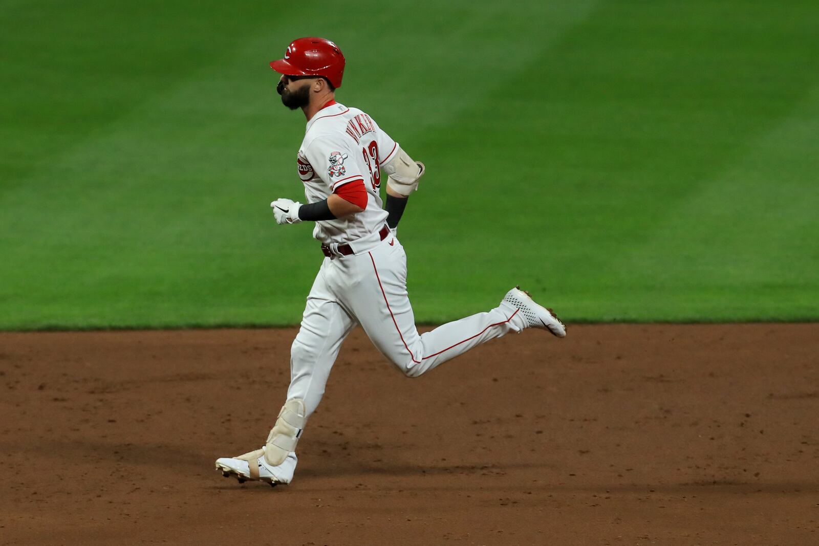 Cincinnati Reds' Jesse Winker runs the bases after hitting a three-run home run during a baseball game against the Chicago White Sox in Cincinnati, Friday, Sept. 18, 2020. The Reds won 7-1. (AP Photo/Aaron Doster)