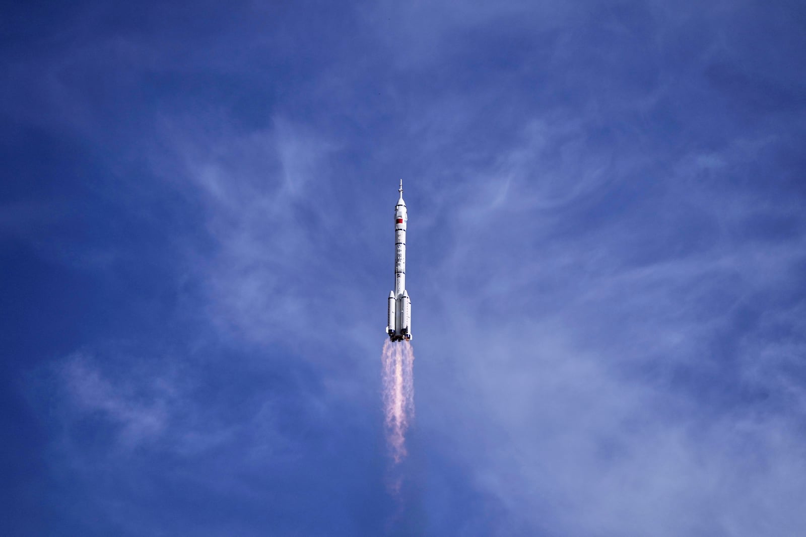 China's Long March 2F rocket, carrying three astronauts for the Shenzhou 20 manned space mission, lifts off for a space station, at the Jiuquan Satellite Launch Center in Jiuquan, northwestern China, Thursday, April 24, 2025. (AP Photo/Andy Wong)