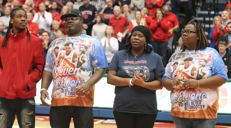Dayton honors the family of Steve McElvene at halftime of a game against Richmond on Sunday, Jan. 6, 2019, at UD Arena. David Jablonski/Staff