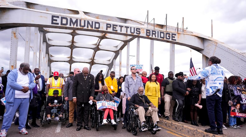 People march over the Edmund Pettus Bridge on the 61st Bloody Sunday Anniversary, Sunday, March 8, 2026, in Selma, Ala. (AP Photo/Mike Stewart)