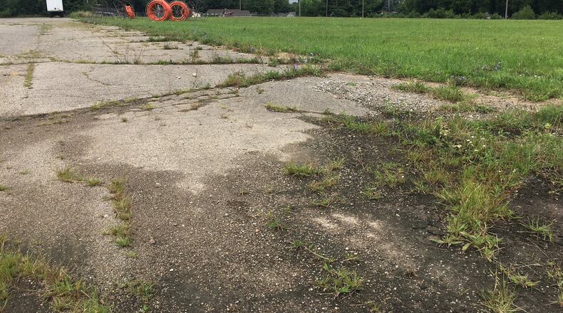 The roughly seven acres behind Dollar General and Community Action Partnership at Dayton and North Allison avenues is slated to be developed into a low-income housing development. RICHARD WILSON/STAFF