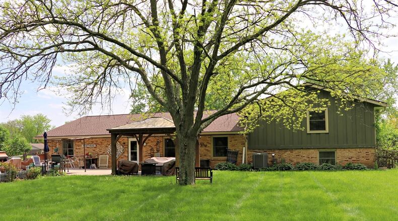 Listed for $310,000, the brick-and-cedar, tri-level home at 408 Beechgrove Drive has about 2,882 square feet of living space. CONTRIBUTED PHOTOS