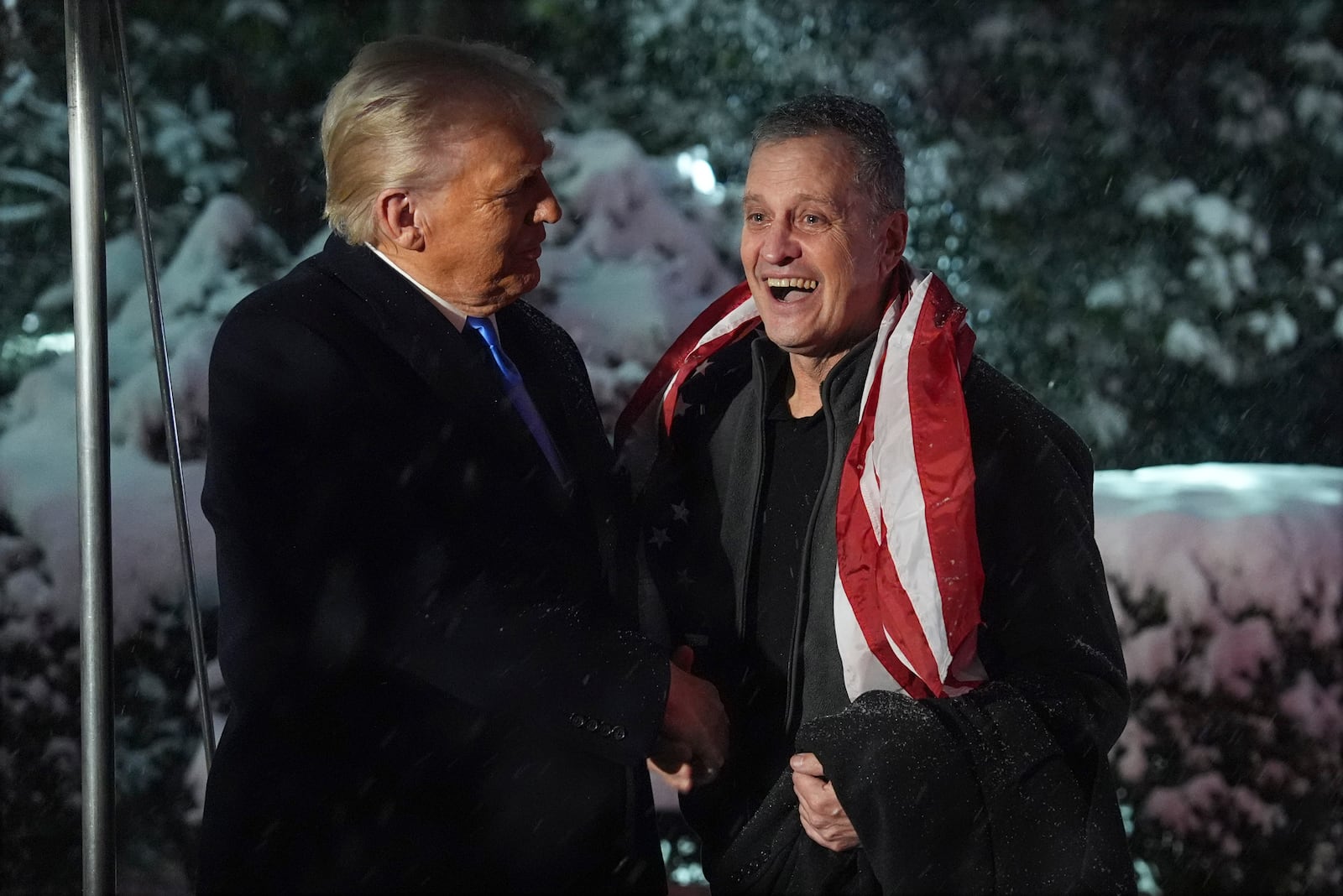 FILE - President Donald Trump greets Marc Fogel on the South Lawn at the White House, Feb. 11, 2025, in Washington. (AP Photo/Evan Vucci, File)