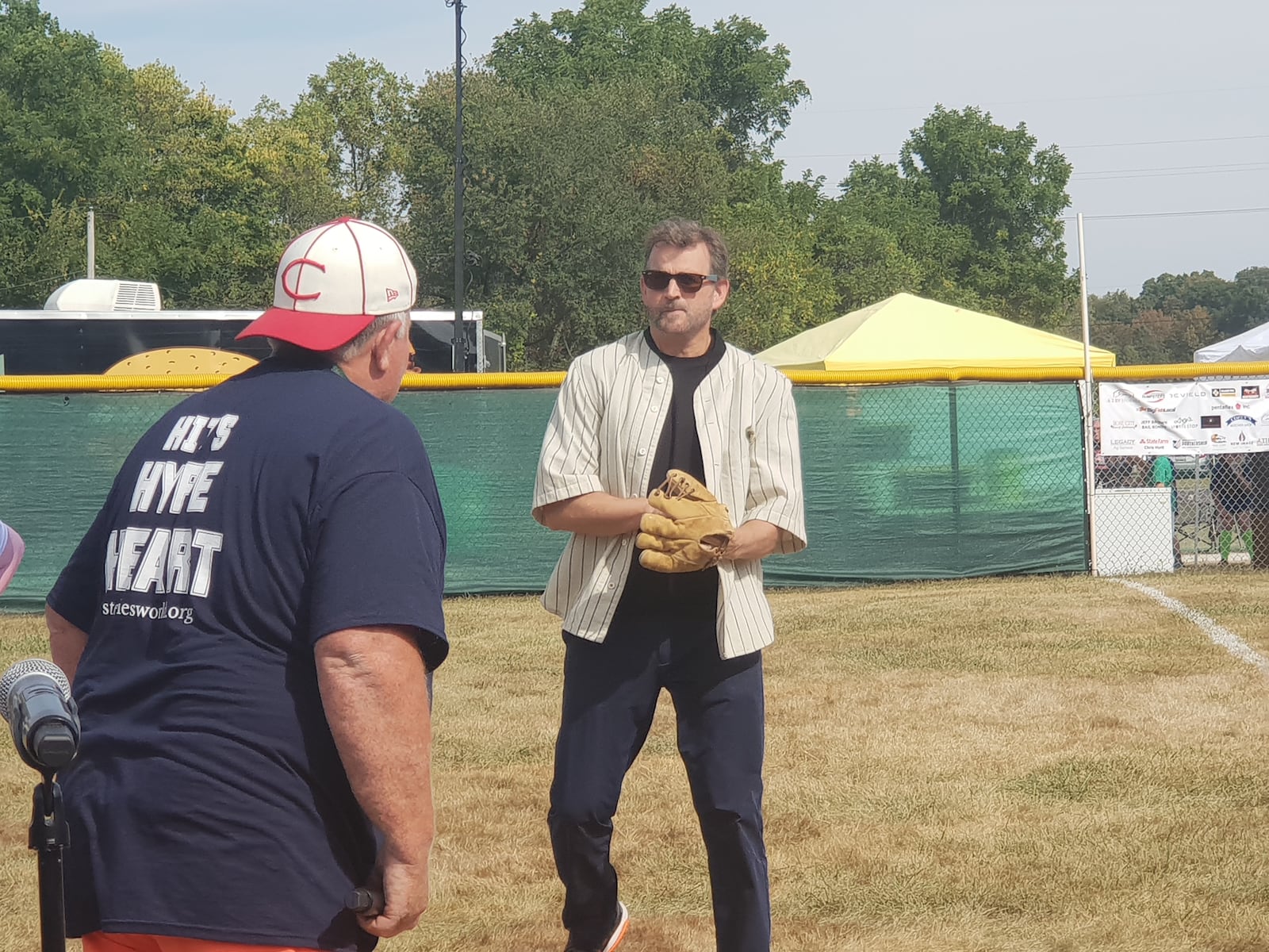 "Field of Dreams" actor Dwier Brown and wiffleball tournament organizer John Leep recreate a scene from "Field of Dreams" during the opening ceremony for the 20th annual Stevie’s World Wiffleball fundraiser. CONTRIBUTED