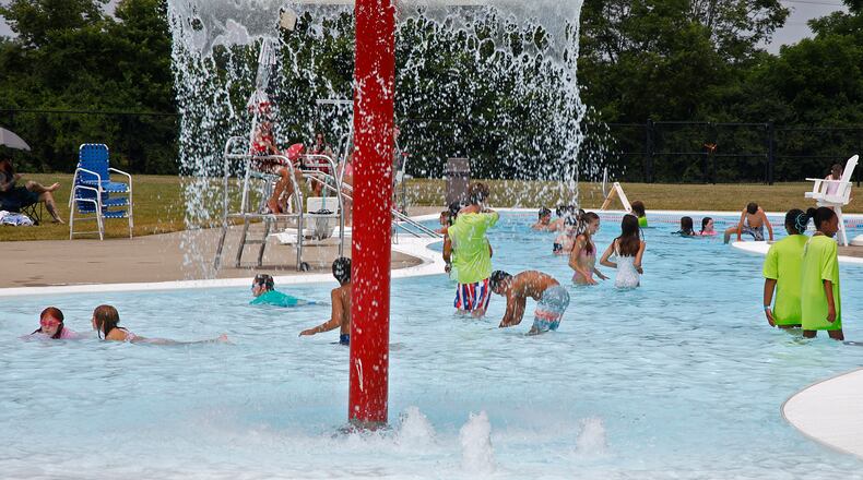Swimmers cool off in the water at Splash Zone water park Tuesday, June 18, 2024. BILL LACKEY/STAFF