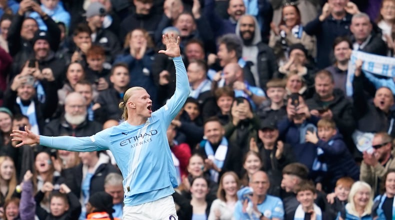 Manchester City's Erling Haaland celebrates after scoring his side's opening goal during the Premier League soccer match between Manchester City and Everton in Manchester, England, Saturday, Oct. 18, 2025. (AP Photo/Dave Thompson)