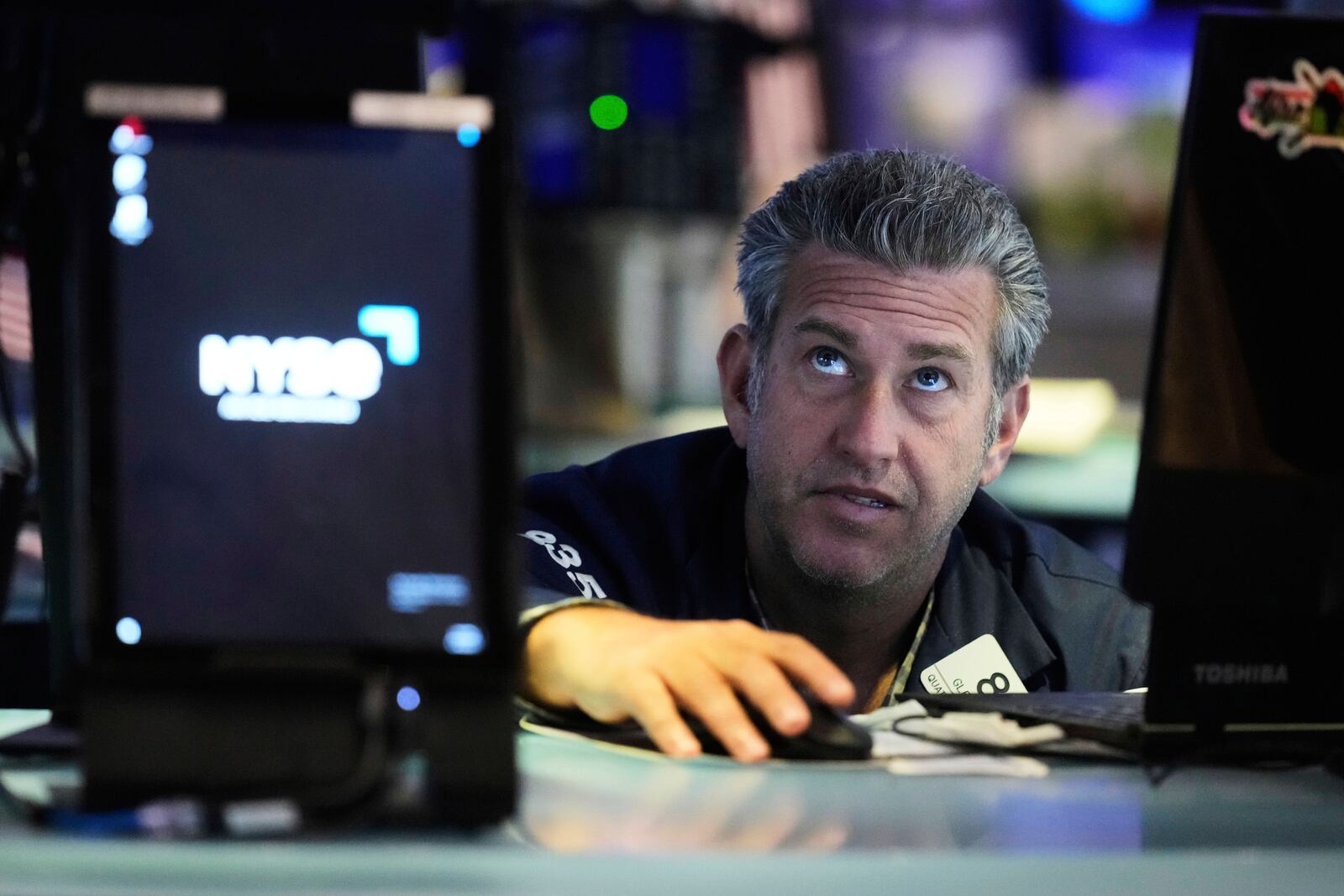 Trader Glenn Kessler works on the floor of the New York Stock Exchange, Monday, April 14, 2025. (AP Photo/Richard Drew)