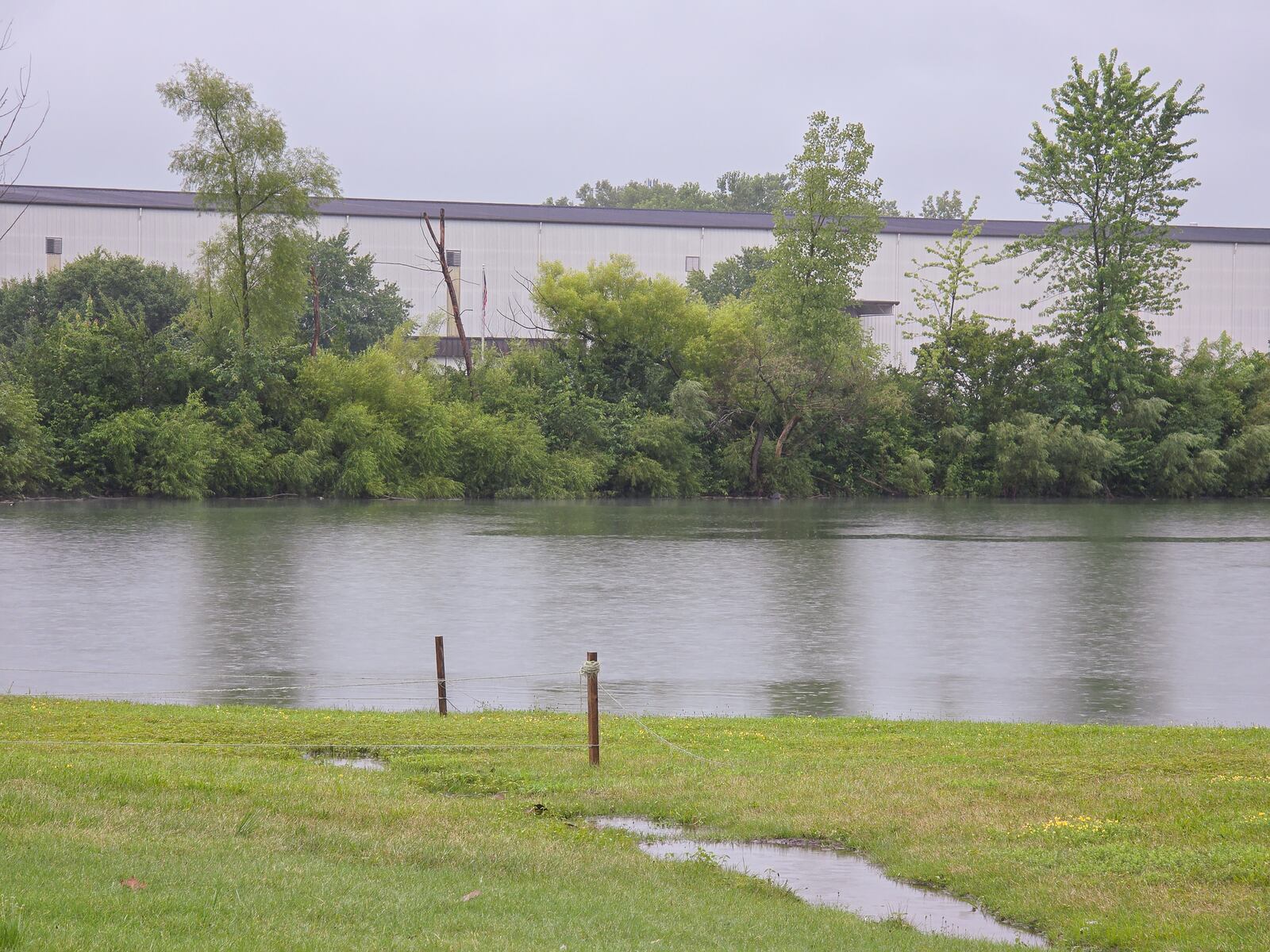 A water-chemical mix of 1,400 gallons leaked into a drainage ditch that flows into a retention pond late on Wednesday, July 30 at Parker Trutec in PrimeOhio Corporate Park near state Route 41 in Springfield. BRYANT BILLING / STAFF