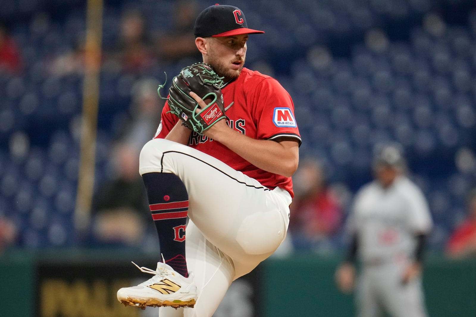 Cleveland Guardians' Tanner Bibee pitches in the first inning of a baseball game against the Minnesota Twins in Cleveland, Tuesday, April 29, 2025. (AP Photo/Sue Ogrocki)