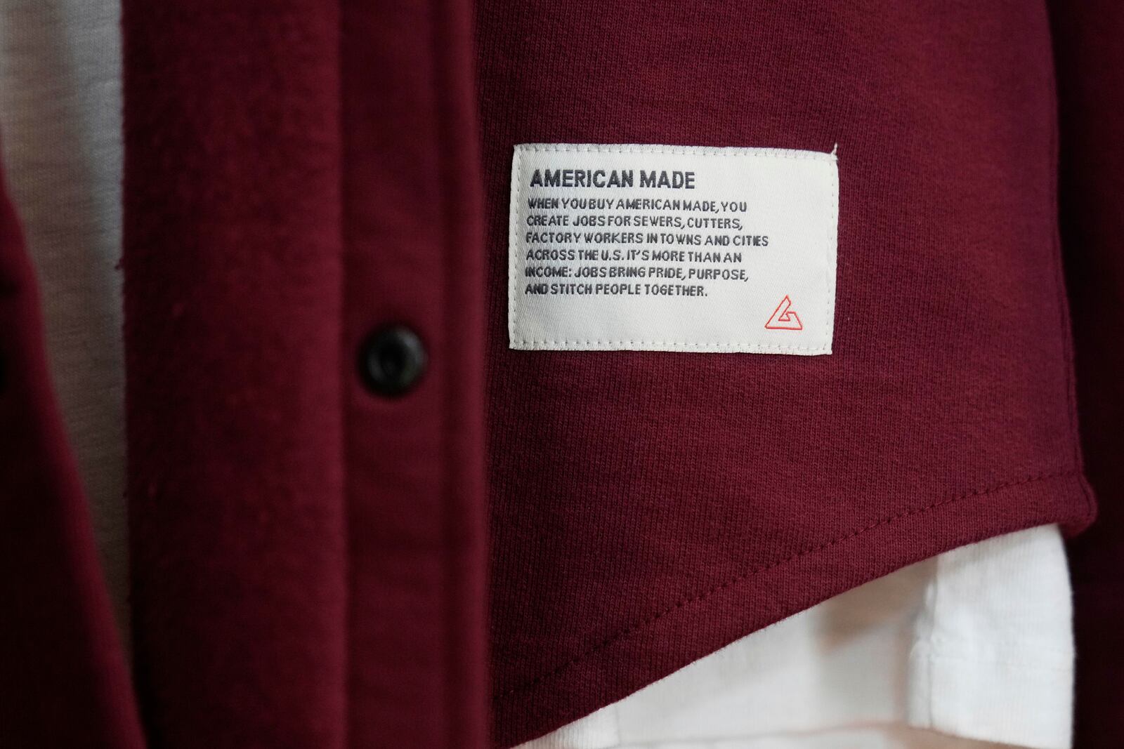 An American Giant tag is shown on clothing at the company's showroom in San Francisco, Thursday, April 17, 2025. (AP Photo/Jeff Chiu)