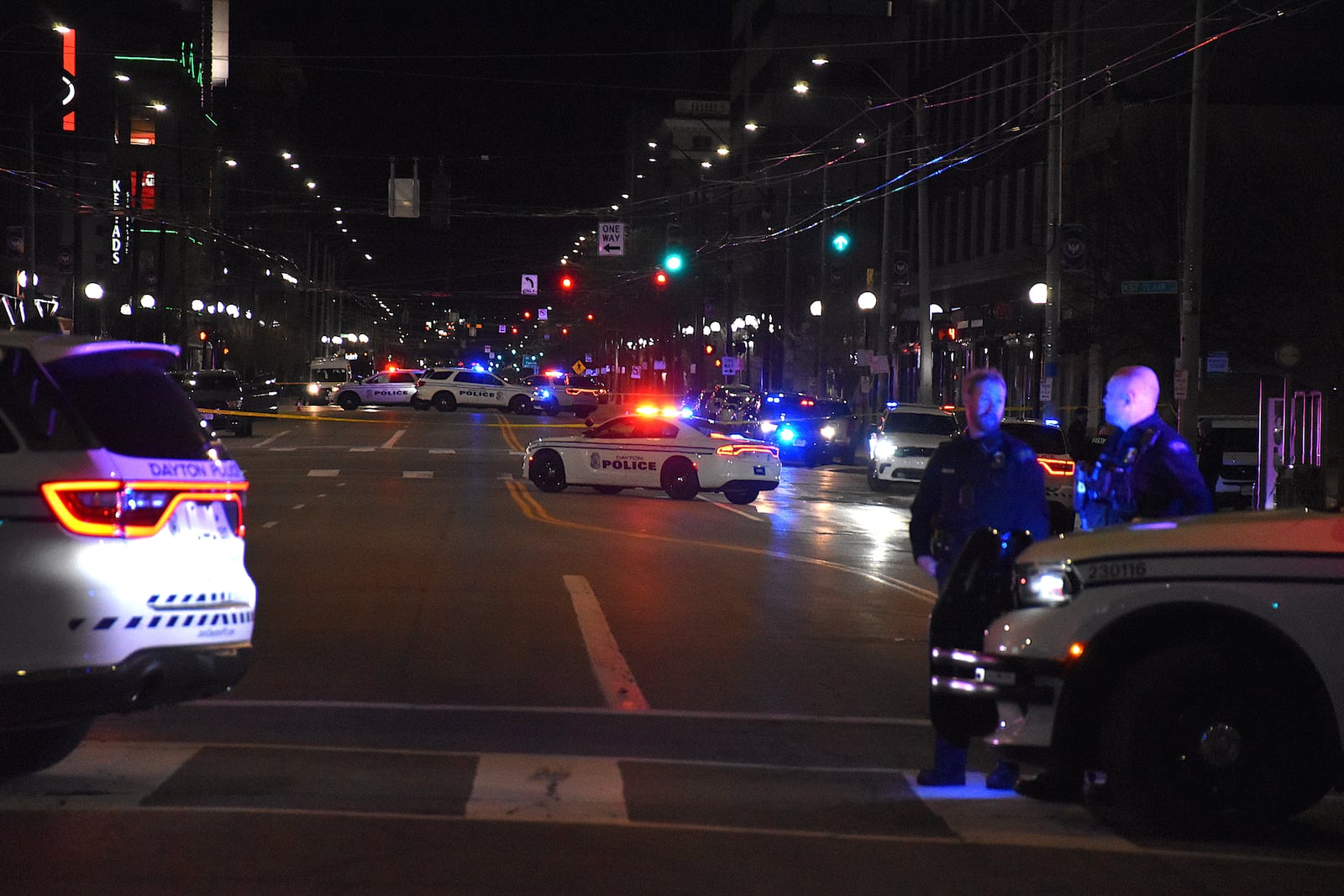 Dayton police blocked off East Third Street from Jefferson Street to Patterson Boulevard after a fatal officer-involved shooting in downtown on Tuesday night. CORNELIUS FROLIK / STAFF