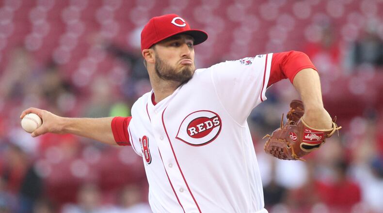 Reds starter Tim Adleman pitches against the Indians on Thursday, May 19, 2016, at Great American Ball Park in Cincinnati. David Jablonski/Staff