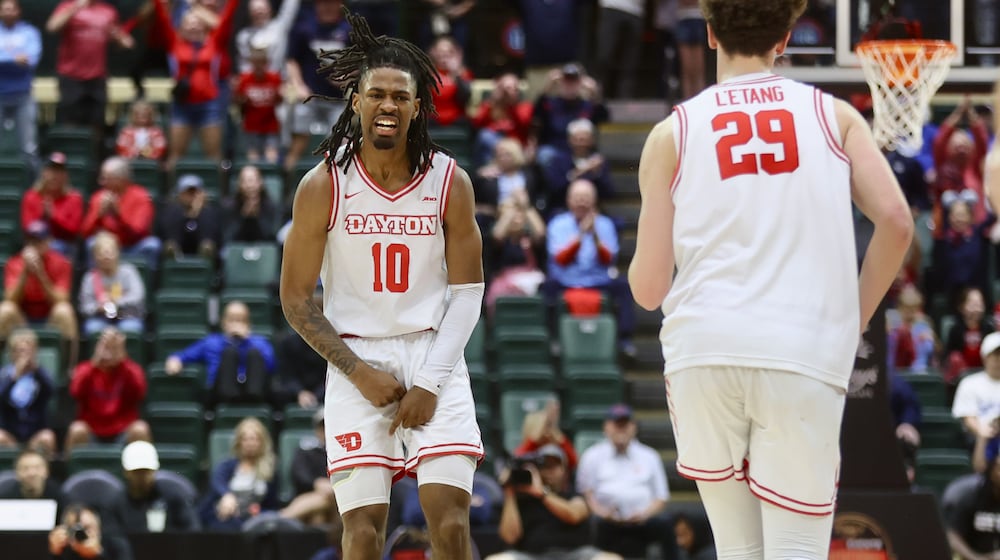 Dayton's Bryce Heard reacts after making a 3-pointer in overtime against Georgetown on Thursday, Nov. 27, 2025, at the State Farm Field House in Kissimmee, Fla. David Jablonski/Staff