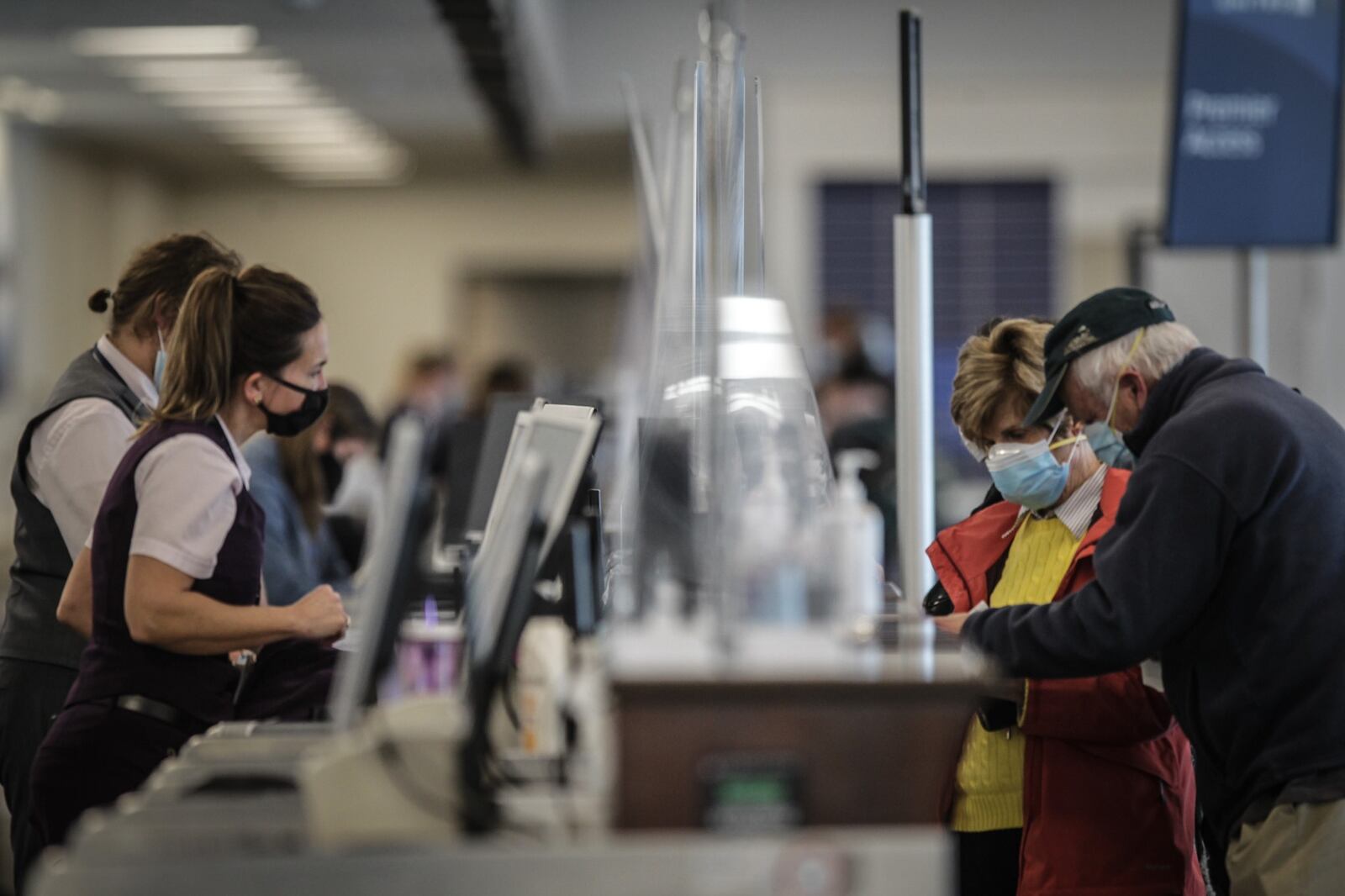 Travelers check in for their flight at Dayton International Airport. Thanksgiving travel is expected to be affected by the price of gas, which may reach a record-setting level by the holiday. NICK GRAHAM/STAFF