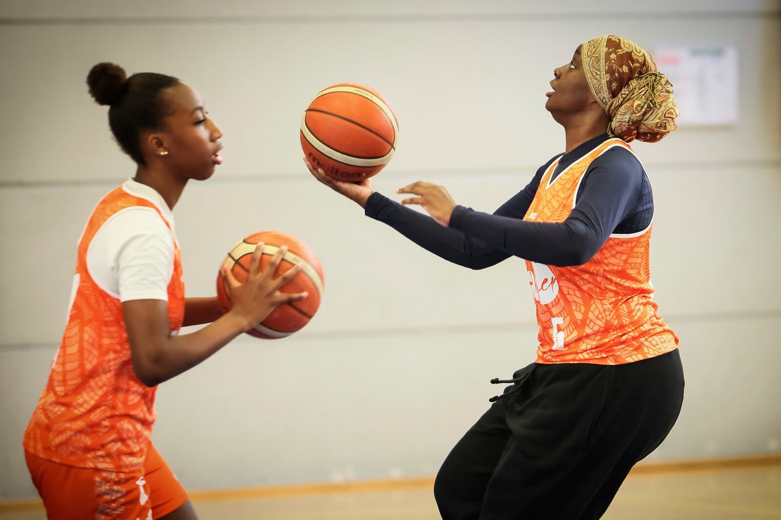 A player wearing a headscarf warms-up before a basketball game, in Aubervilliers near Paris, Sunday, April 27, 2025. (AP Photo/Thomas Padilla)