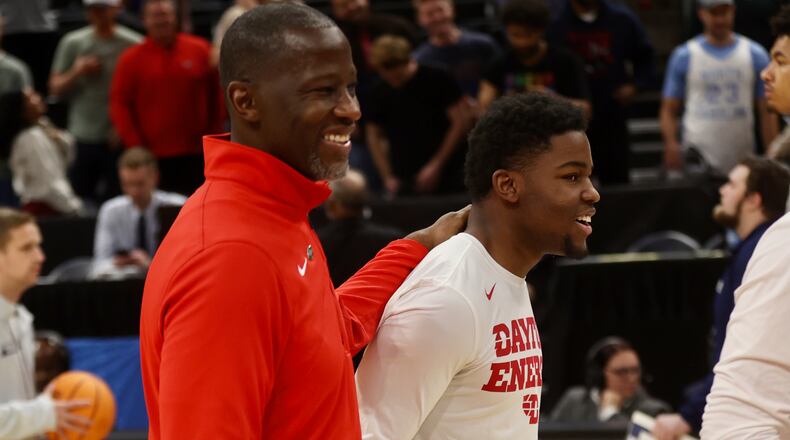 Dayton's Anthony Grant and Makai Grant leave the court after a victory against Nevada in the first round of the NCAA tournament on Thursday, March 21, 2024, at the Delta Center in Salt Lake City, Utah. David Jablonski/Staff