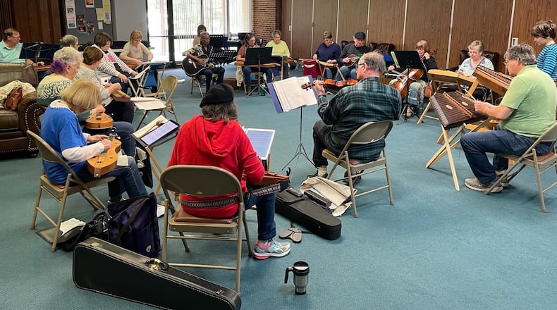 Musicians with other instruments, including guitar, mandolin, fiddle and cello, join in with dulcimer players at a meeting of the Springfield Dulcimer Club. CONTRIBUTED