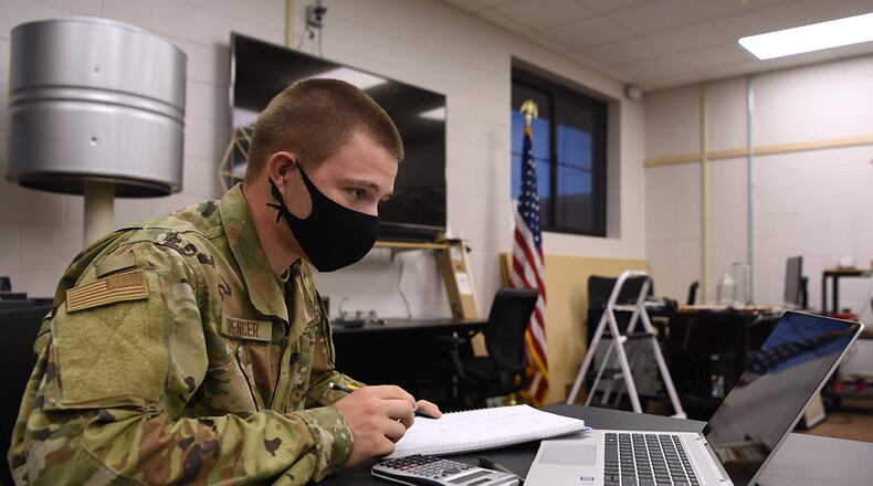 Airman Connor Spencer, 312th Training Squadron Special Instruments Training course student, surveys mathematical materials inside the Louis F. Garland Department of Defense Fire Academy on Goodfellow Air Force Base, Texas, Aug. 19. Spencer reviewed linear equations on his third day in the classroom. (U.S. Air Force photo/Senior Airman Abbey Rieves)