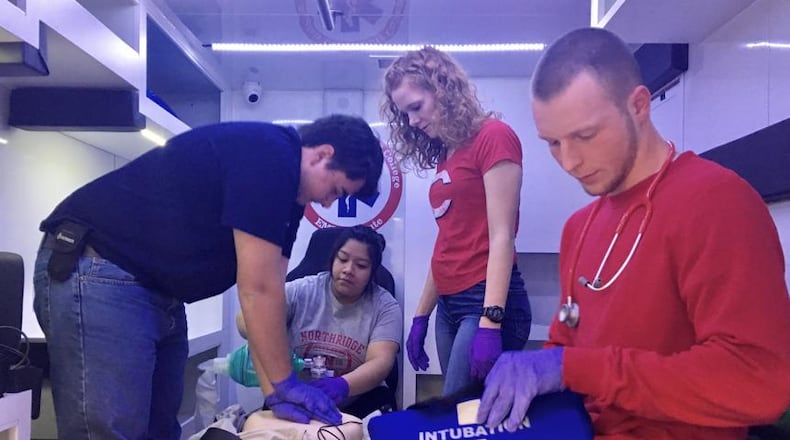 FILE: Students in Sinclair’s EMT certificate program practice in an ambulance simulator in the college’s new health sciences center. The EMT certificate program is a technical certificate.