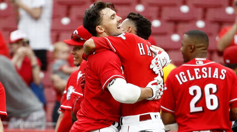 CINCINNATI, OH - MAY 09: Adam Duvall #23 of the Cincinnati Reds hugs Billy Hamilton #6 after hitting a walk off home run in the 10th inning for a 2-1 win over the New York Mets at Great American Ball Park on May 9, 2018 in Cincinnati, Ohio. (Photo by Andy Lyons/Getty Images)