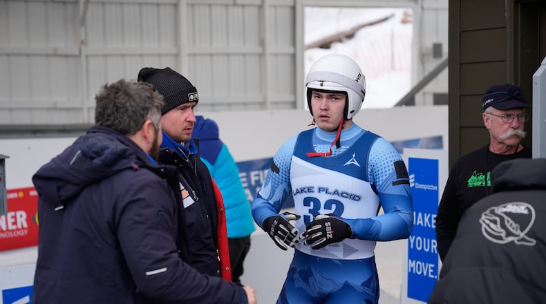 Russian athlete Matvei Perestoronin finishes a qualifying race to compete in a Luge World Cup event in Lake Placid, N.Y., Thursday, Dec. 18, 2025. (AP Photo/Seth Wenig)
