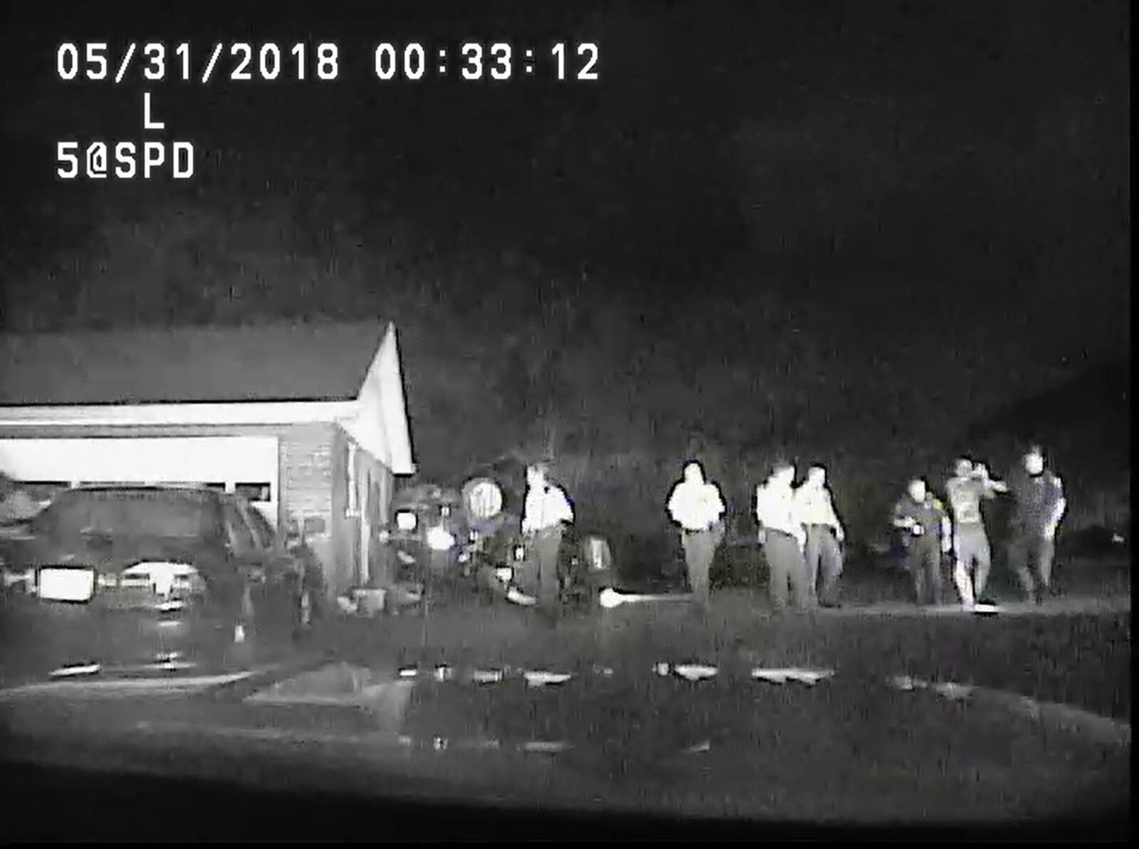 Dash-cam footage from Sharonville police show Joshua Beall being escorted from a stolen vehicle after a short police pursuit Thursday morning. Beall is a suspect in a homicide that took place Wednesday in Dayton, police said.