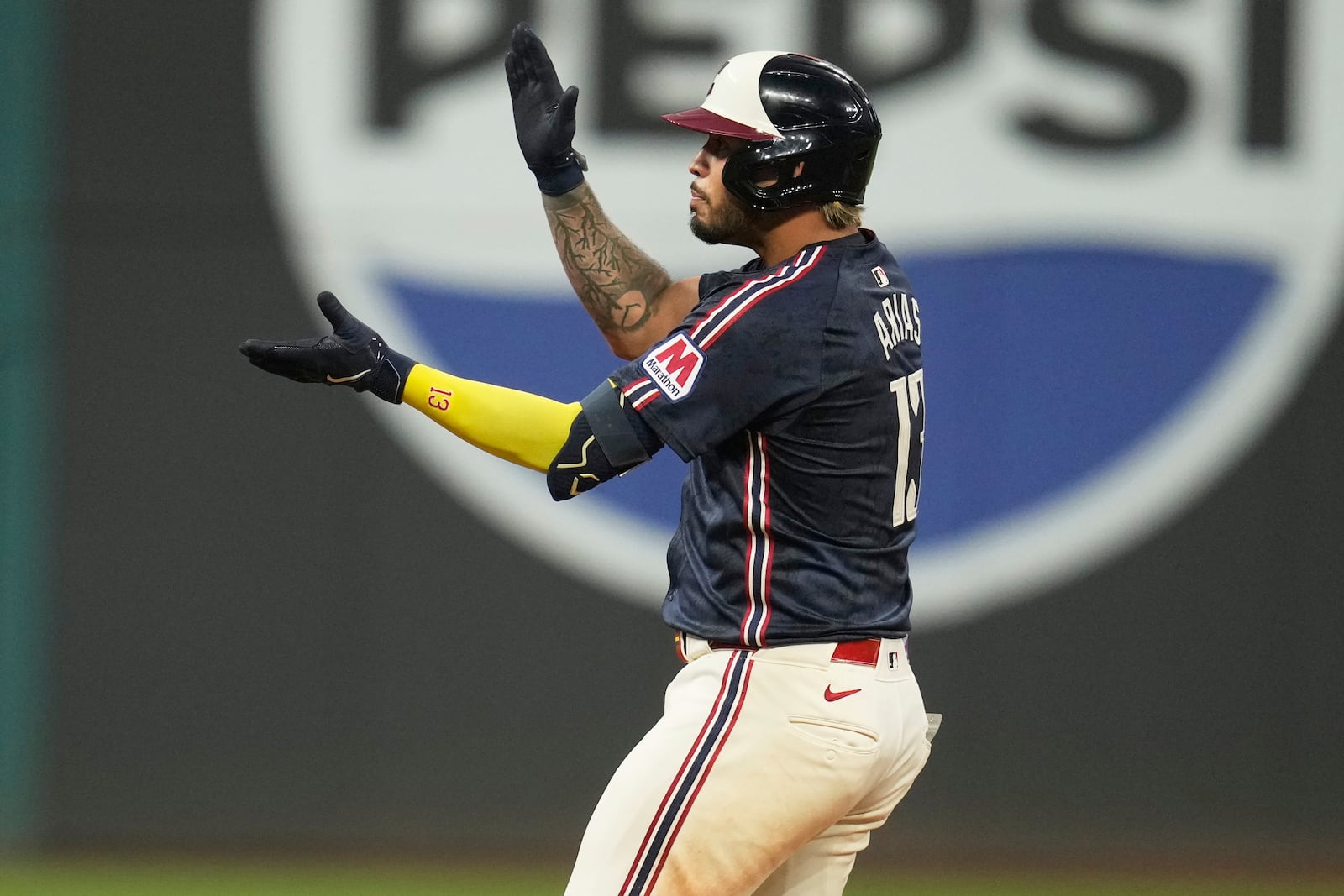 Cleveland Guardians' Gabriel Arias gestures from second base after hitting a double in the seventh inning of a baseball game against the Houston Astros in Cleveland, Friday, June 6, 2025. (AP Photo/Sue Ogrocki)