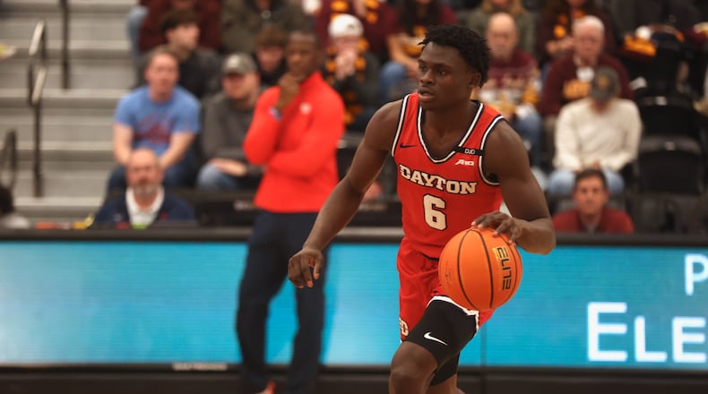 Dayton's Enoch Cheeks dribbles against Loyola Chicago on Friday, Feb. 21, 2025, at Gentile Arena in Chicago. David Jablonski/Staff