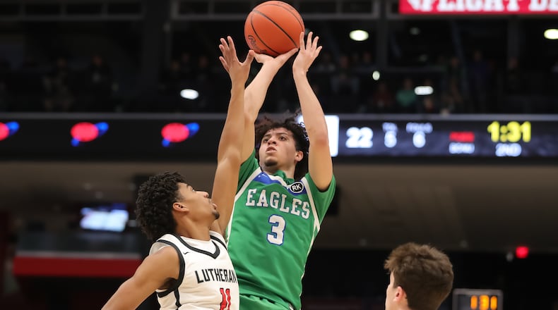 Chaminade Julienne senior George Washington III shoots the ball over Lutheran West's Lewis Smith during their game on Friday morning at University of Dayton Arena. CONTRIBUTED PHOTO BY MICHAEL COOPER