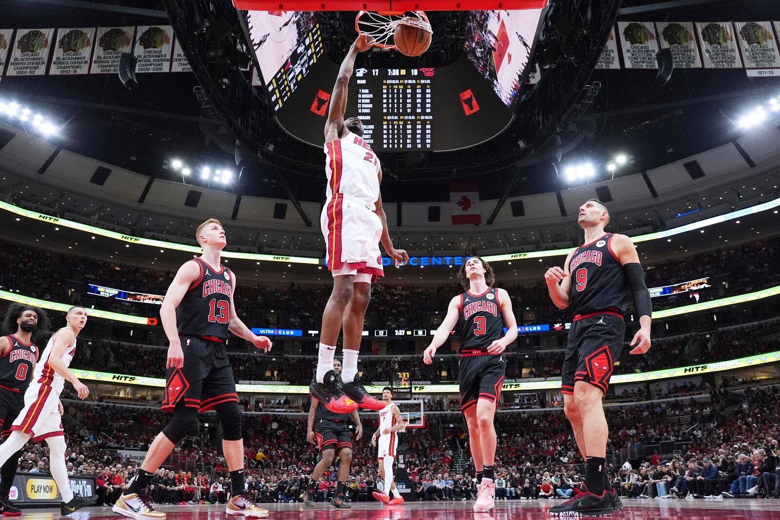 Miami Heat forward Andrew Wiggins, top, dunks against the Chicago Bulls during the first half of an NBA play-in tournament basketball game in Chicago, Wednesday, April 16, 2025. (AP Photo/Nam Y. Huh)