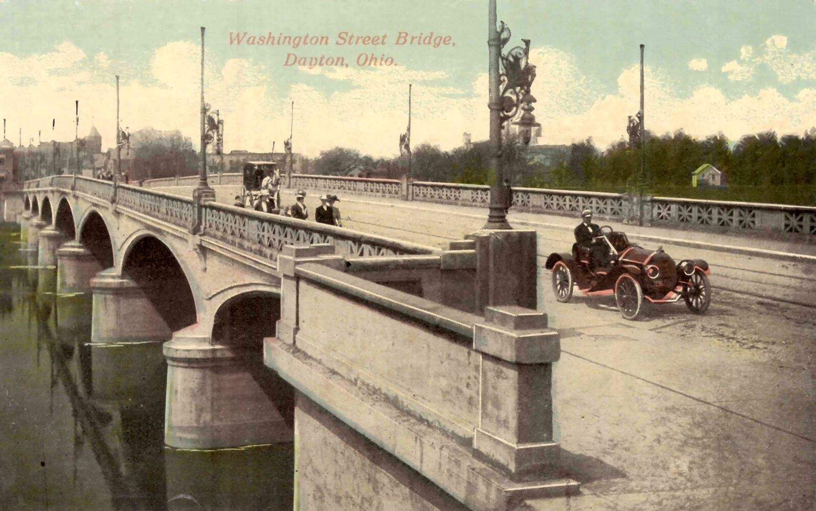 A roadster and pedestrians travel the picturesque Washington Street Bridge in Dayton. DAYTON METRO LIBRARY