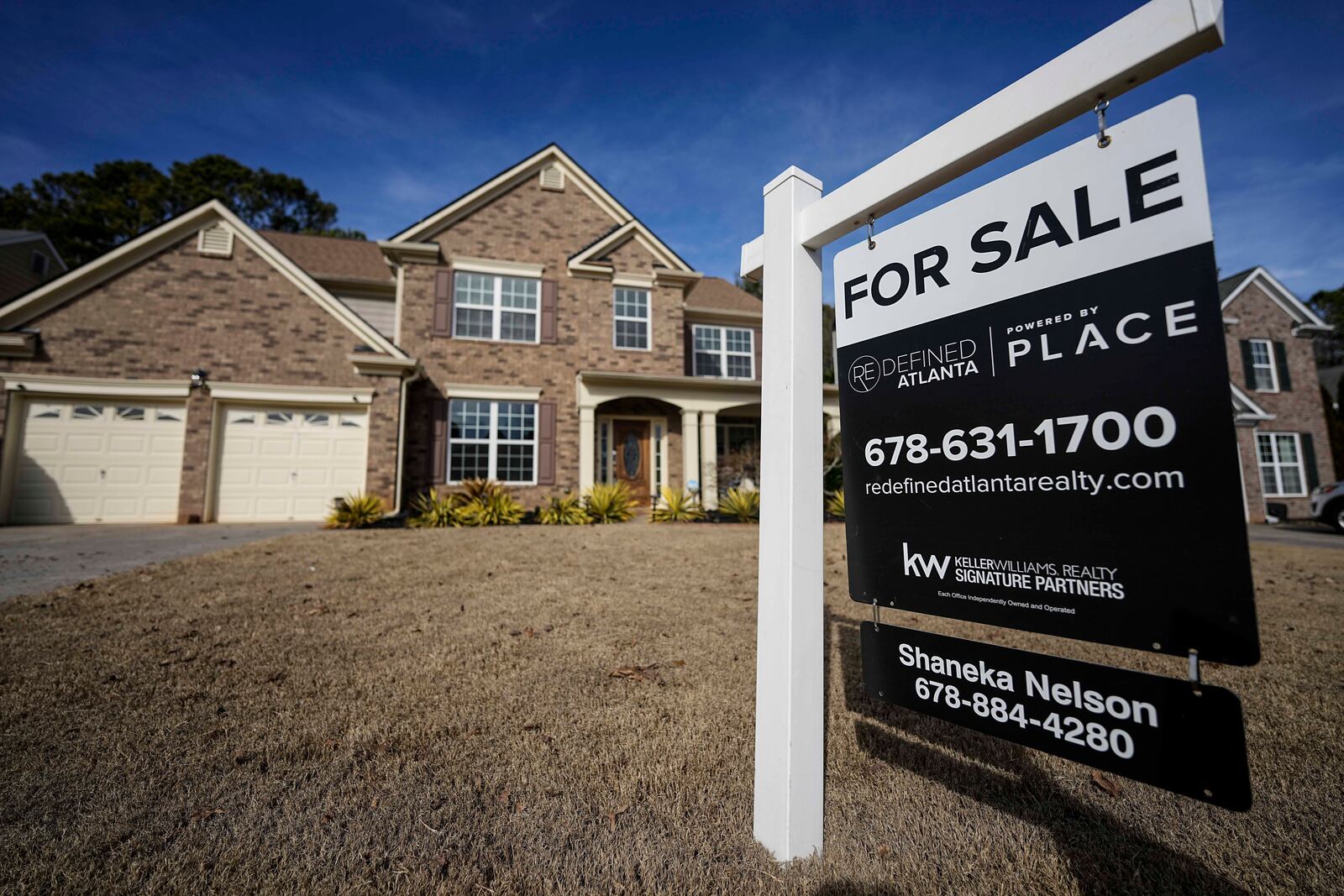 FILE - A sign announcing a home for sale is posted outside a home, Thursday, Feb. 1, 2024, in Aceworth, Ga., near Atlanta. (AP Photo/Mike Stewart, File)