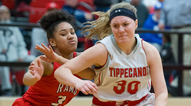 Tippecanoe junior guard Alison Mader dribbles with pressure from Trotwood’s Essence Thorton during a Division II sectional final on Saturday at Tecumseh. BRYANT BILLING / CONTRIBUTED