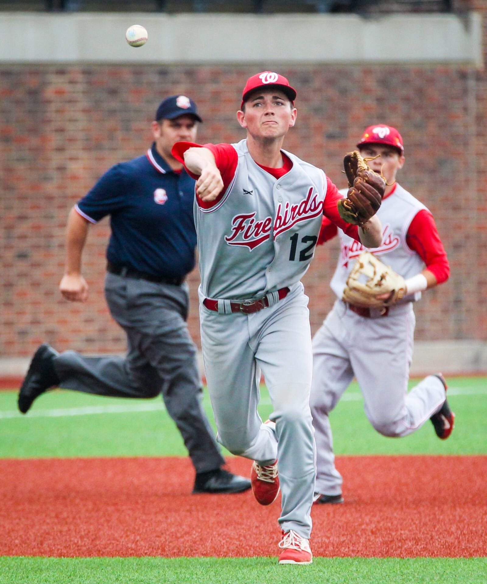 Lakota West third baseman Josh Harrison (12) throws across the diamond for an out during their Division I regional semifinal against Centerville on Thursday at the University of Cincinnati’s Marge Schott Stadium. GREG LYNCH/STAFF