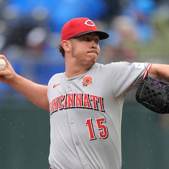 FILE - Cincinnati Reds relief pitcher Emilio Pagan throws during the ninth inning of a baseball game against the Kansas City Royals, May 26, 2025, in Kansas City, Mo. (AP Photo/Charlie Riedel, File)