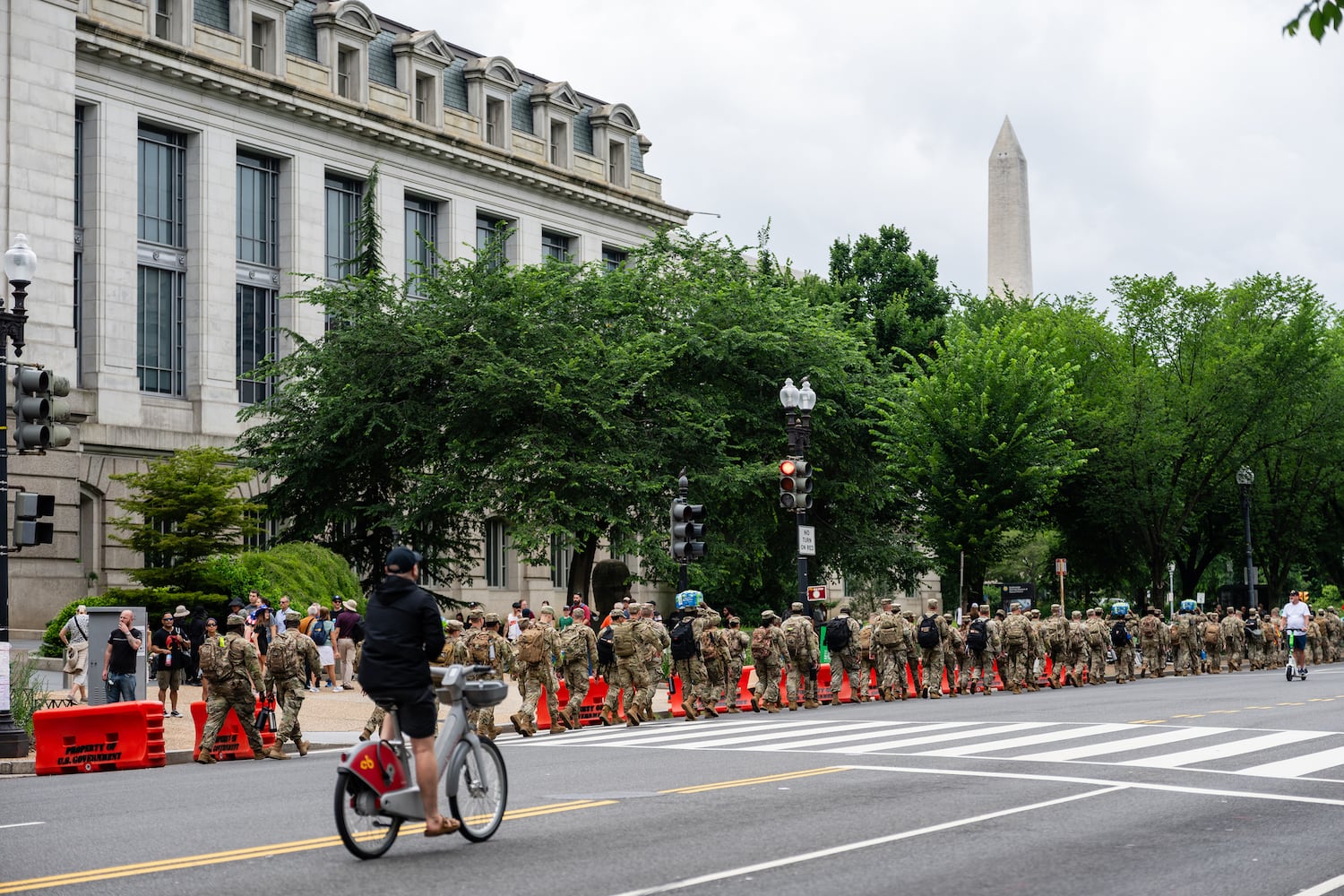 Troops carry supplies ahead of the U.S. Army's 250th Anniversary Parade along the National Mall in Washington on Saturday, June 14, 2025. (Eric Lee/The New York Times)
