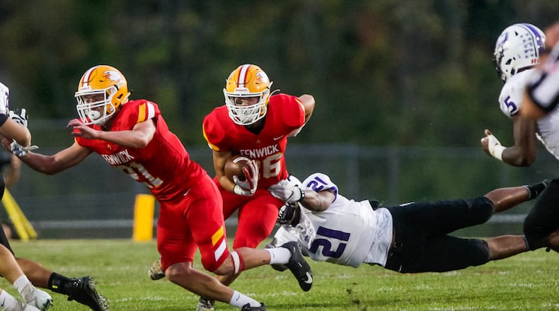 Fenwick's Logan Miller runs the ball during their football game against St. Francis DeSales Friday, Sept. 27 at Bishop Fenwick High School. St. Francis DeSales won 42-22. NICK GRAHAM/STAFF