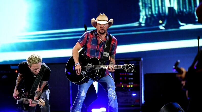 LAS VEGAS, NV - SEPTEMBER 21:  Tully Kennedy (L) and Jason Aldean perform onstage during the 2018 iHeartRadio Music Festival at T-Mobile Arena on September 21, 2018 in Las Vegas, Nevada.  (Photo by Kevin Winter/Getty Images for iHeartMedia)