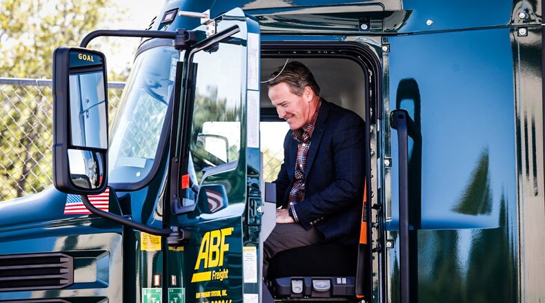 Ohio Lt. Gov. Jon Husted checks out a ABF semi-truck at the company's terminal on Center Point Boulevard in Huber Heights Tuesday October 10, 2023. Husted was at the freight way to announce new Ohio Bureau of Motor Vehicles modernizations, in including online renewal of Commercial Driver's License or CDLs. JIM NOELKER/STAFF