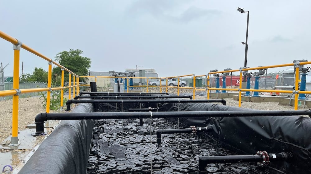 A basin of water on Wright-Patterson Air Force Base on Thursday June 5, 2025, part of a system designed to capture and filter contaminants from water on the base's Area B. THOMAS GNAU/STAFF