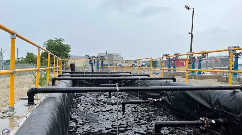 A basin of water on Wright-Patterson Air Force Base on Thursday June 5, 2025, part of a system designed to capture and filter contaminants from water on the base's Area B. THOMAS GNAU/STAFF